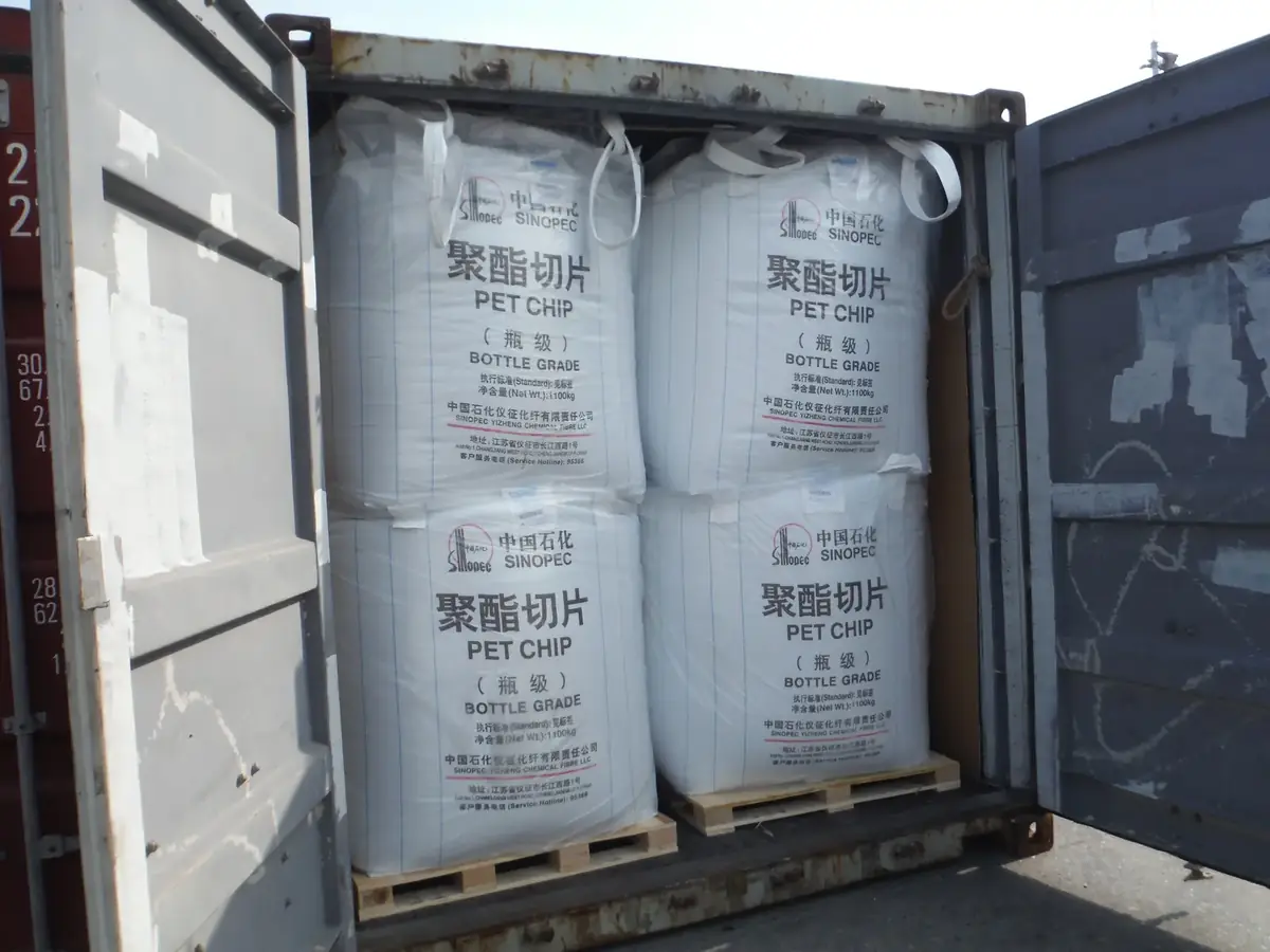 Two layers of jumbo bags of bottle-grade PET chips loaded inside a shipping container