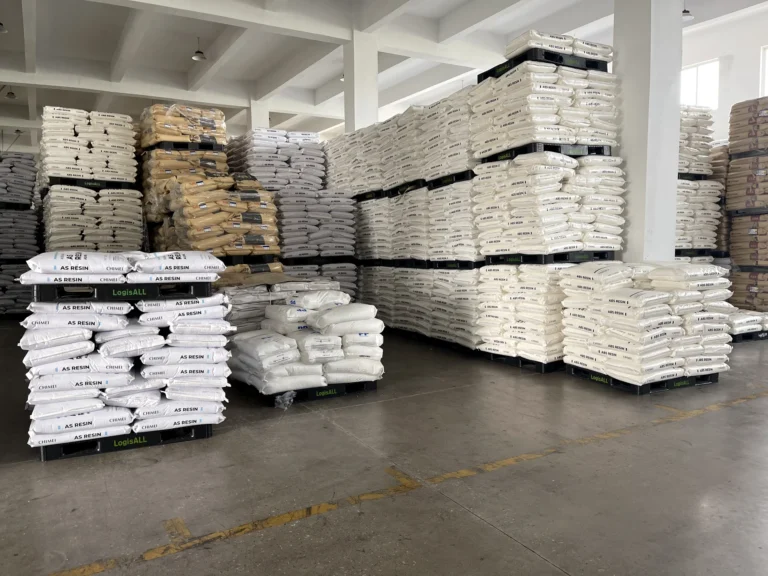 Bags of plastic resin stored in a warehouse